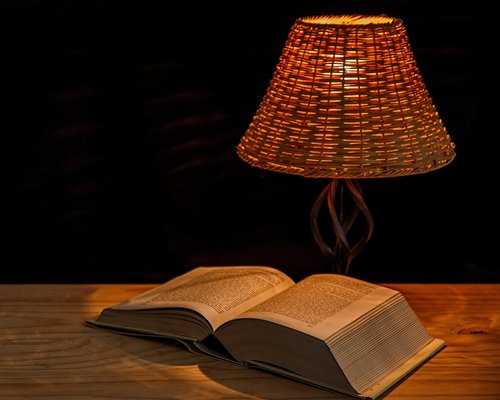 Cozy reading corner with warm evening lamp lighting